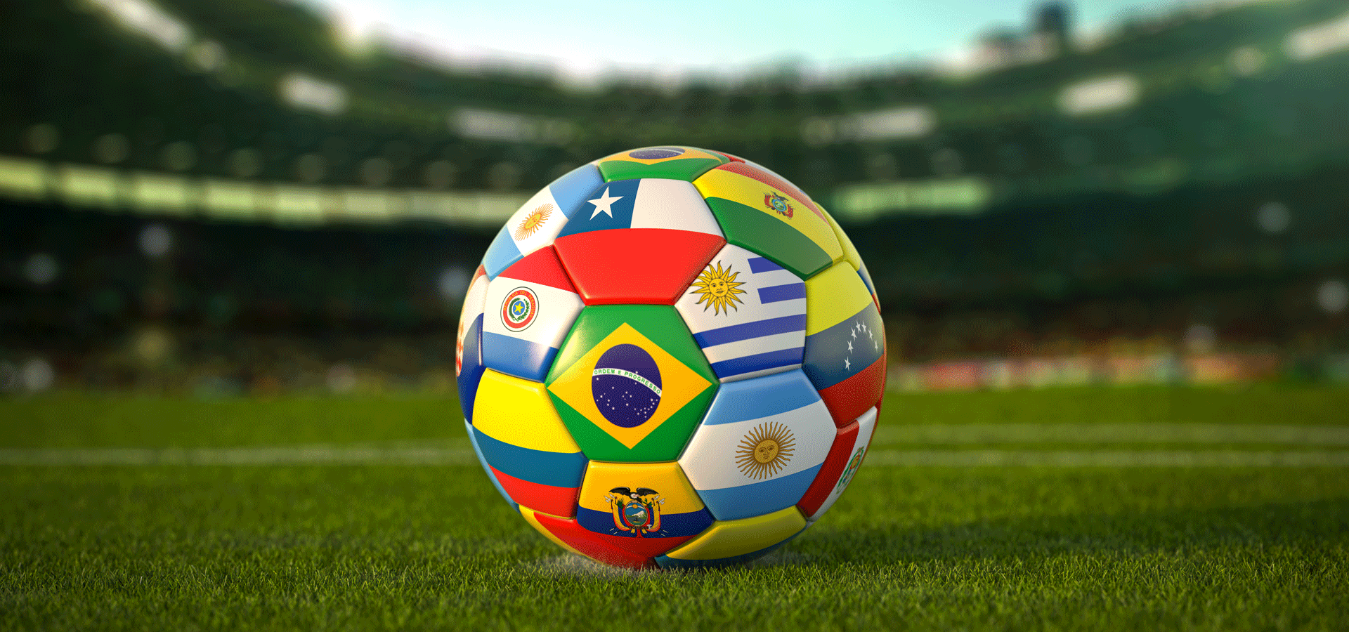 soccer ball with South American flags on it in a stadium