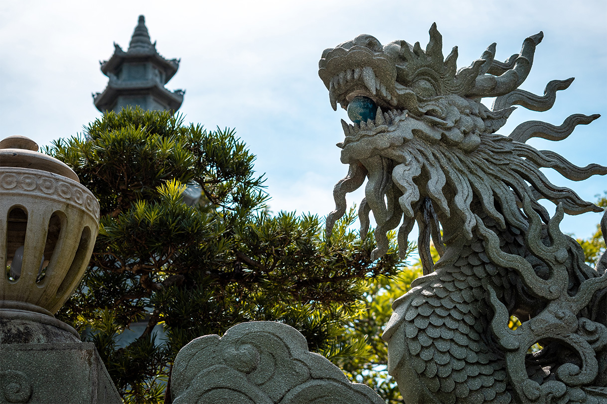 Temple entrance with dragon statue, Vietnam.