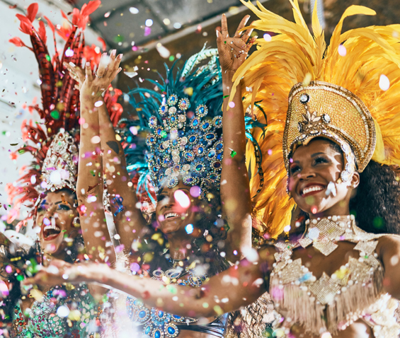 three women dancing Samba at carnival in Brazil