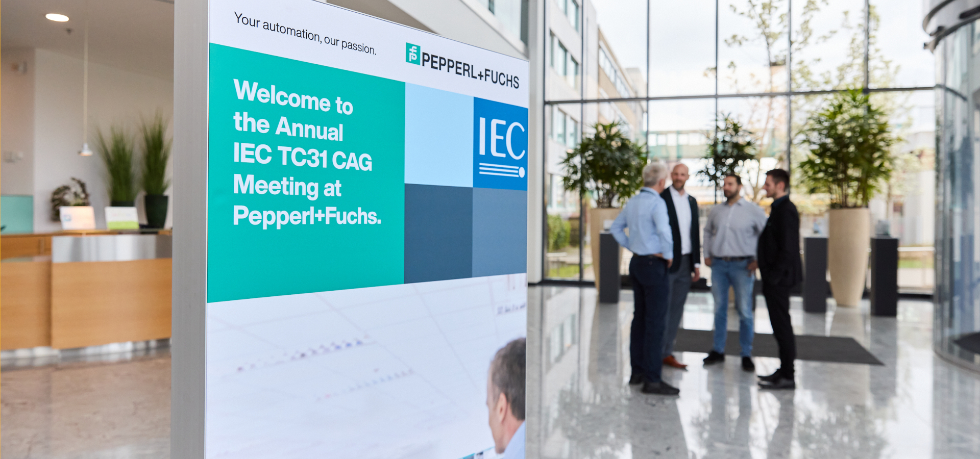 Foyer of Pepperl+Fuchs with a roll up for the IEC TC 31 spring meeting